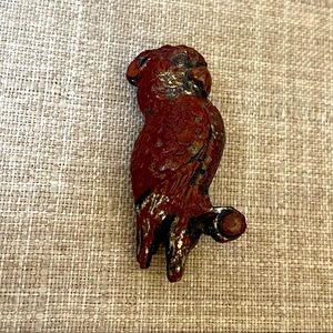 Kitschy distressed parrot pin